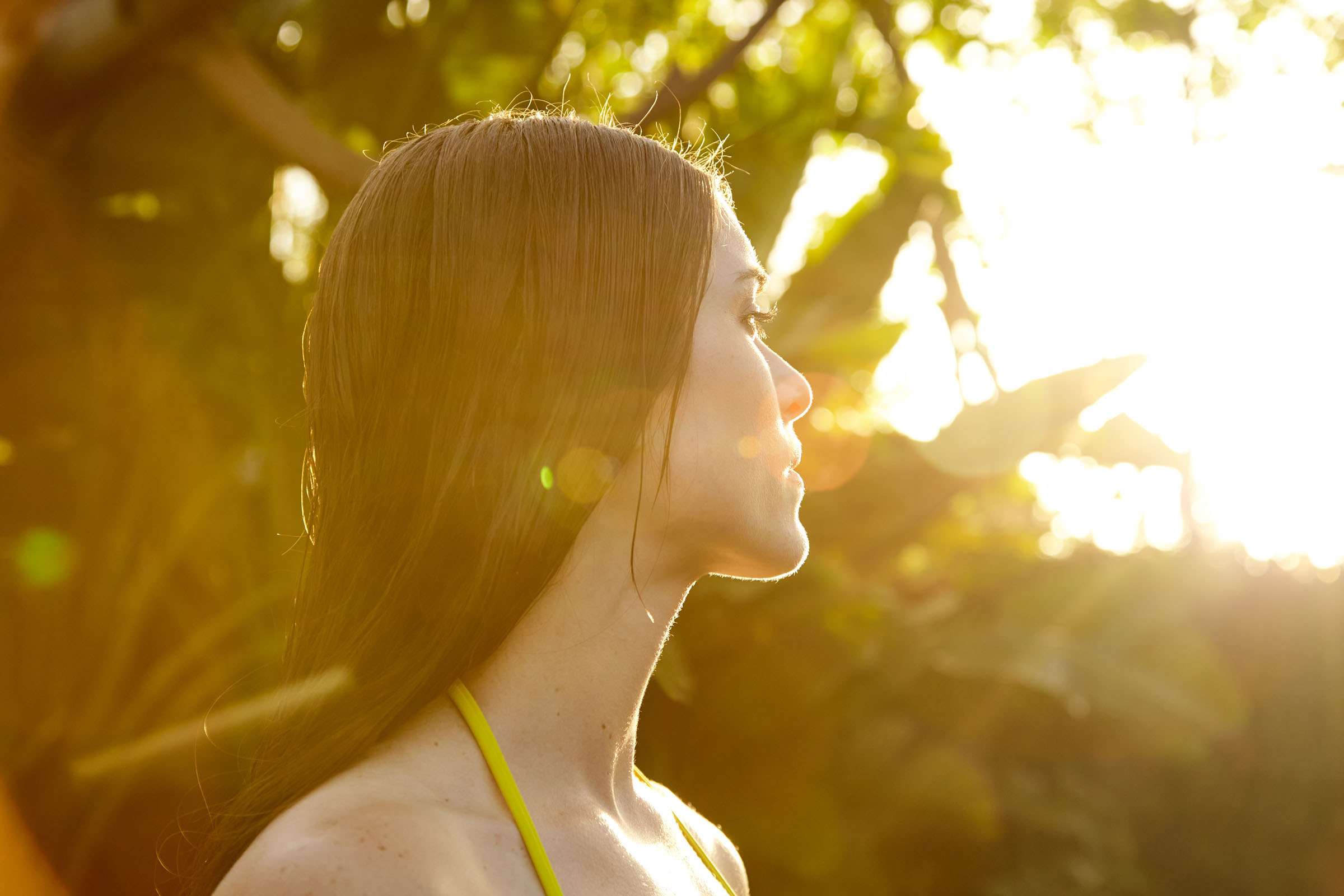 Close-up portrait of woman in nature at sunrise on vacation at spa