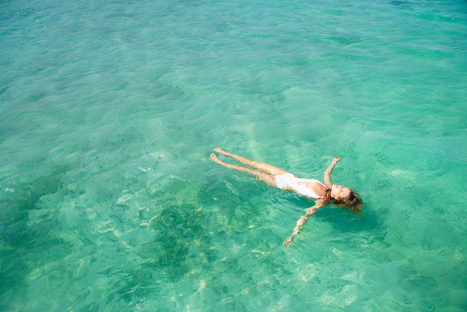 Floating in ocean St. Barths  | Trinette+Chris Photographers