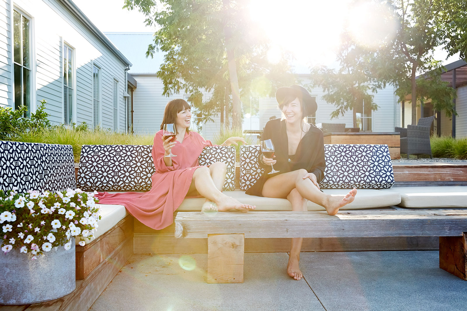 Friends having wine in backyard  | Trinette+Chris Photographers